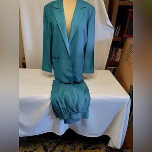 This pant suit is teal not blue. It is very comfortable.